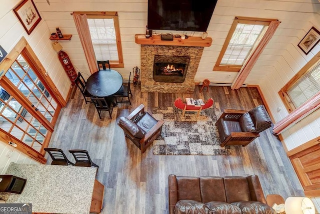 369 Trillium Rd, Suches, GA 30572 - living room with wood finished floors, a fireplace, and wooden walls
