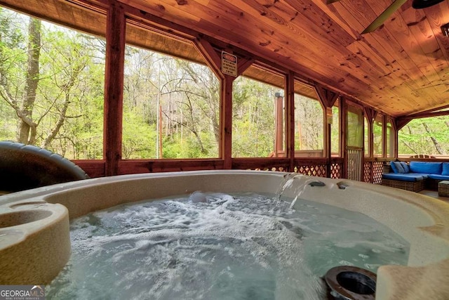 369 Trillium Rd, Suches, GA 30572 - sunroom / solarium with a hot tub, lofted ceiling, healthy amount of natural light, and a view of trees