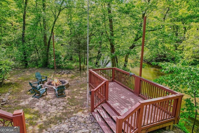 369 Trillium Rd, Suches, GA 30572 - wooden deck with a fire pit and a wooded view