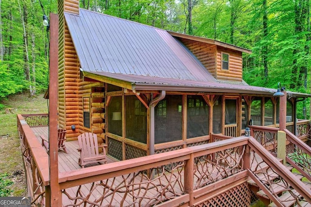 369 Trillium Rd, Suches, GA 30572 - wooden deck featuring a sunroom, a view of trees, and stairway