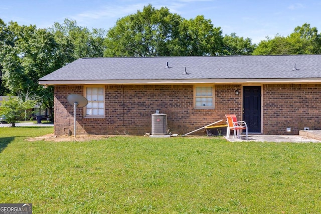 19 Hannon Way, Cartersville, GA 30120 - rear view of house with a yard, brick siding, cooling unit, and a shingled roof