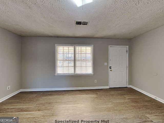 19 Hannon Way, Cartersville, GA 30120 - foyer featuring wood finished floors, baseboards, and a textured ceiling