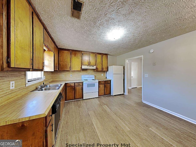 19 Hannon Way, Cartersville, GA 30120 - kitchen featuring white appliances, under cabinet range hood, a sink, light countertops, and brown cabinets
