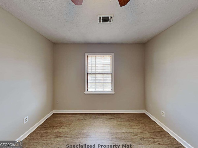 19 Hannon Way, Cartersville, GA 30120 - spare room with ceiling fan, baseboards, wood finished floors, and a textured ceiling