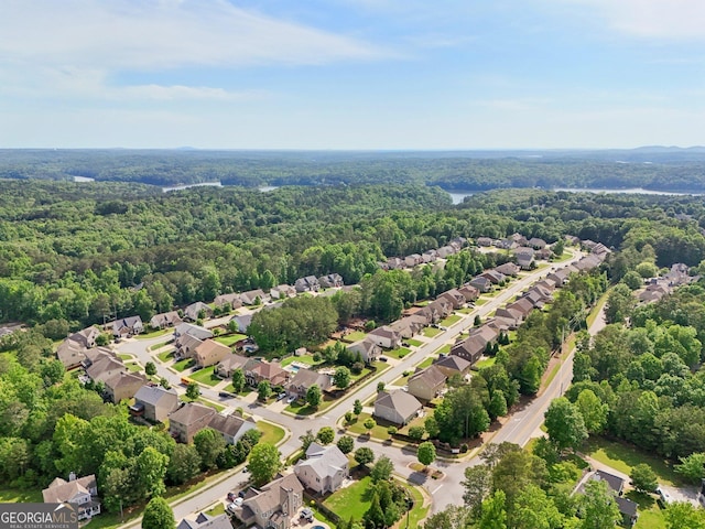 aerial view of residential area with a forest