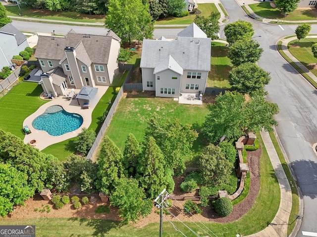 aerial view of residential area with a pool area