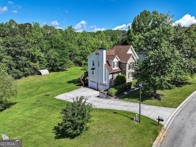 view from above of property with a forest