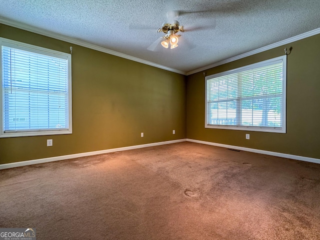 carpeted spare room with crown molding, ceiling fan, a textured ceiling, and baseboards