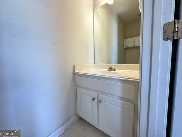 bathroom featuring vanity and baseboards