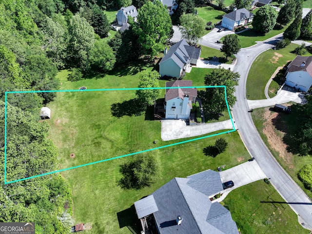 aerial view of residential area with property boundaries highlighted