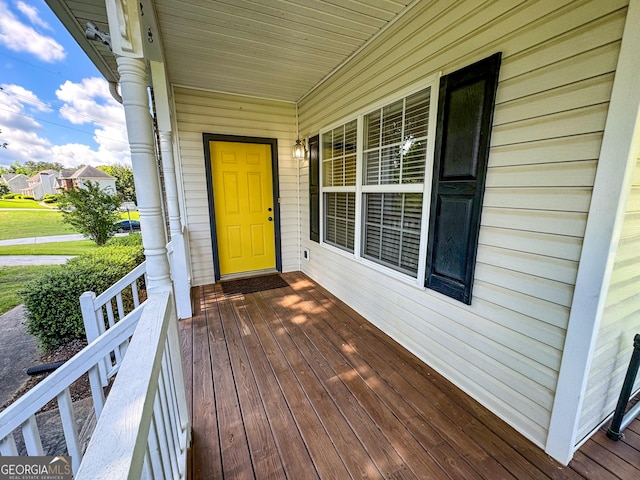 view of exterior entry featuring a porch