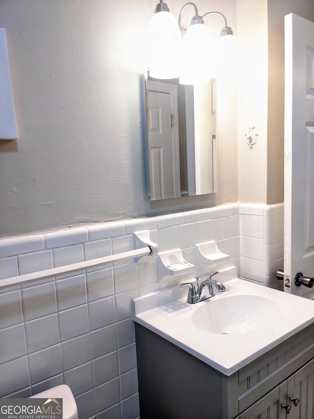 67 Sprayberry Rd, Newnan, GA 30263 - bathroom featuring vanity, wainscoting, and tile walls