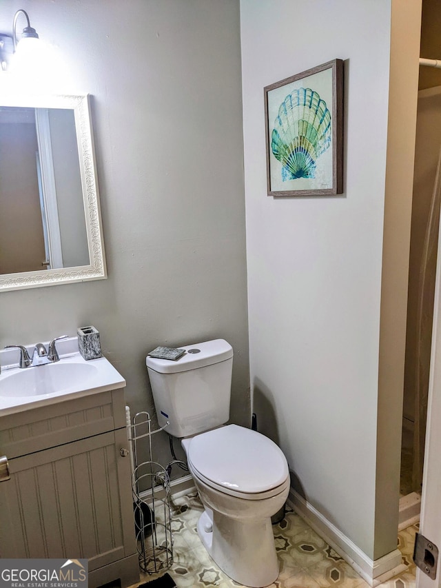 67 Sprayberry Rd, Newnan, GA 30263 - bathroom featuring baseboards, toilet, and vanity