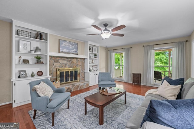 1870 Shoreline Trce, Grayson, GA 30017 - living area with wood finished floors, a fireplace, ceiling fan, baseboards, and built in features