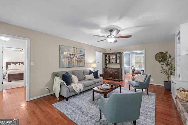 1870 Shoreline Trce, Grayson, GA 30017 - living area with ceiling fan, wood finished floors, and baseboards