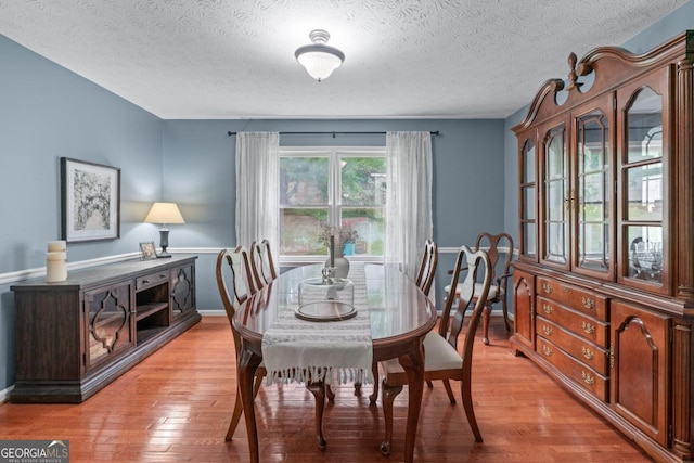1870 Shoreline Trce, Grayson, GA 30017 - dining area featuring a textured ceiling, baseboards, and light wood finished floors