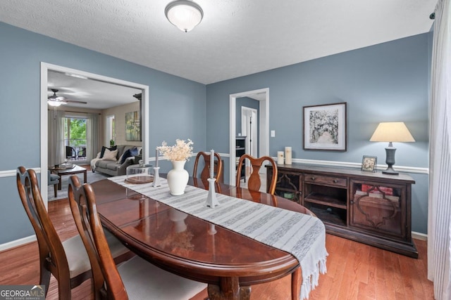 1870 Shoreline Trce, Grayson, GA 30017 - dining area with wood finished floors, a ceiling fan, and baseboards