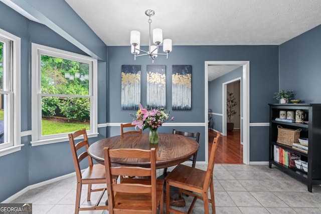 1870 Shoreline Trce, Grayson, GA 30017 - dining space featuring healthy amount of natural light, a chandelier, light tile patterned floors, baseboards, and a textured ceiling