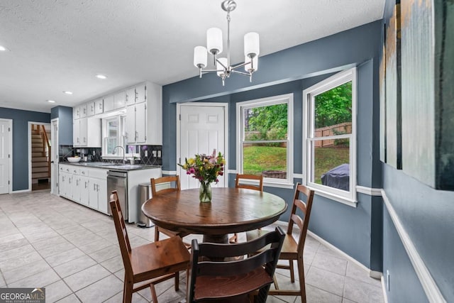 1870 Shoreline Trce, Grayson, GA 30017 - dining area with light tile patterned floors, a chandelier, baseboards, a textured ceiling, and recessed lighting