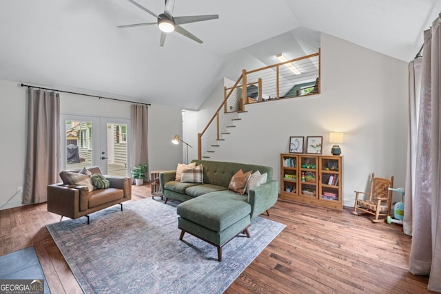 1870 Shoreline Trce, Grayson, GA 30017 - living room featuring a ceiling fan, wood finished floors, lofted ceiling, french doors, and stairs