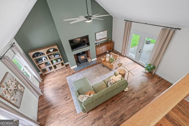 1870 Shoreline Trce, Grayson, GA 30017 - living area featuring wood finished floors, high vaulted ceiling, healthy amount of natural light, and a ceiling fan