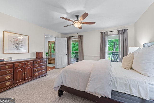 1870 Shoreline Trce, Grayson, GA 30017 - bedroom featuring access to outside, light colored carpet, and a ceiling fan