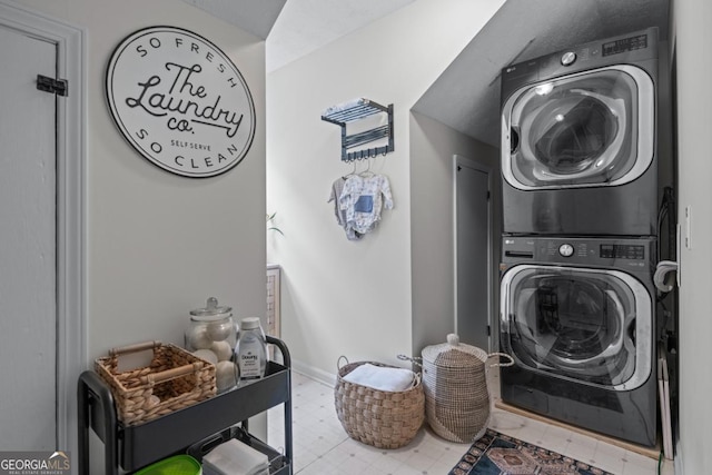 1870 Shoreline Trce, Grayson, GA 30017 - laundry room with stacked washer / dryer and tile patterned floors