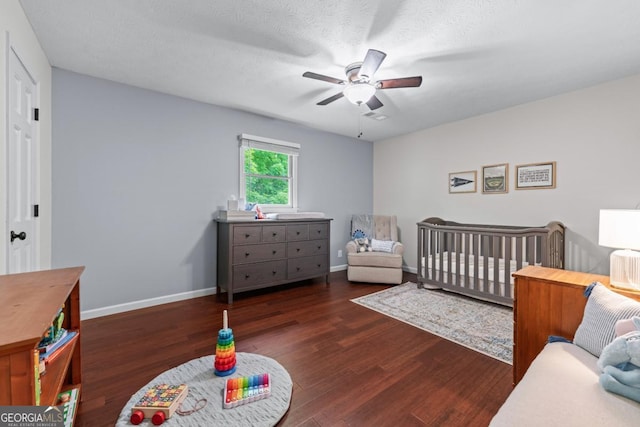 1870 Shoreline Trce, Grayson, GA 30017 - bedroom with wood finished floors, a crib, baseboards, and ceiling fan