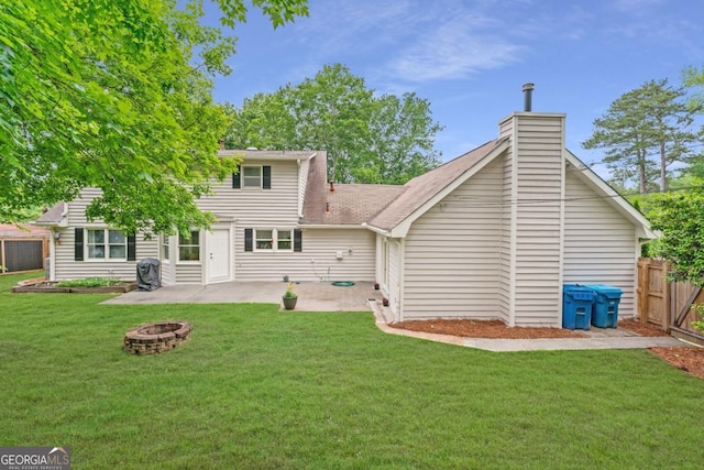 1870 Shoreline Trce, Grayson, GA 30017 - rear view of house featuring a patio, an outdoor fire pit, and a chimney