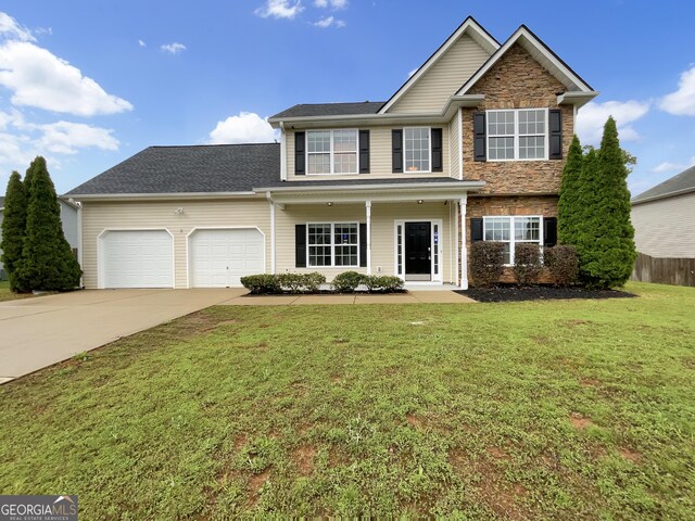 617 Kyles Cir, Hiram, GA 30141 - traditional-style home with an attached garage, concrete driveway, and stone siding