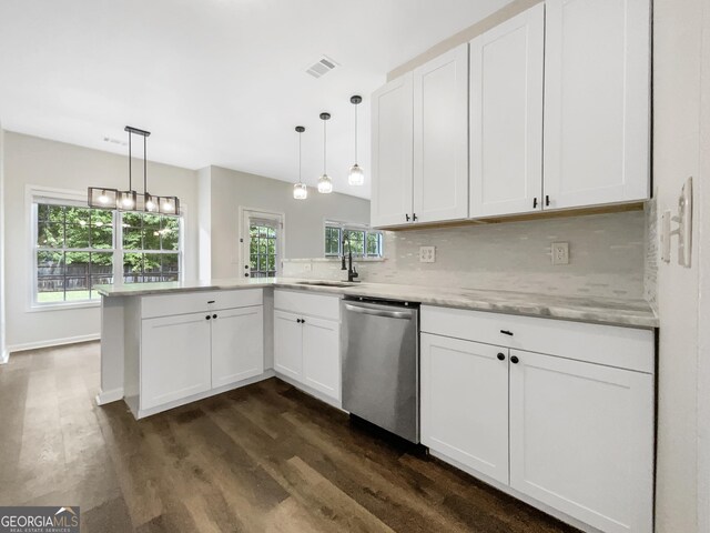 617 Kyles Cir, Hiram, GA 30141 - kitchen with stainless steel dishwasher, a peninsula, dark wood finished floors, and a sink