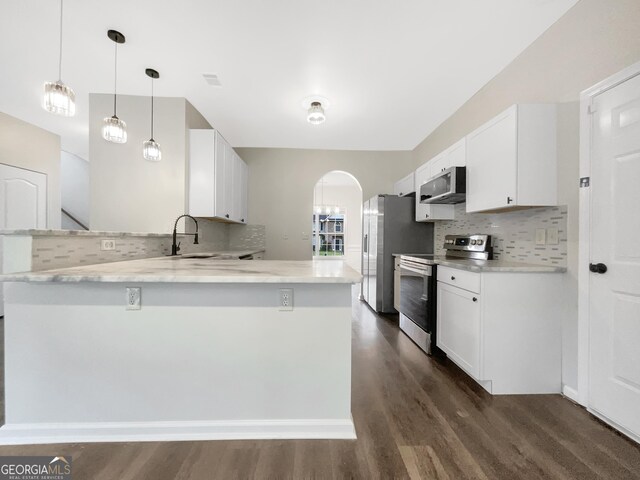 617 Kyles Cir, Hiram, GA 30141 - unfurnished dining area featuring healthy amount of natural light, dark wood-style floors, and baseboards
