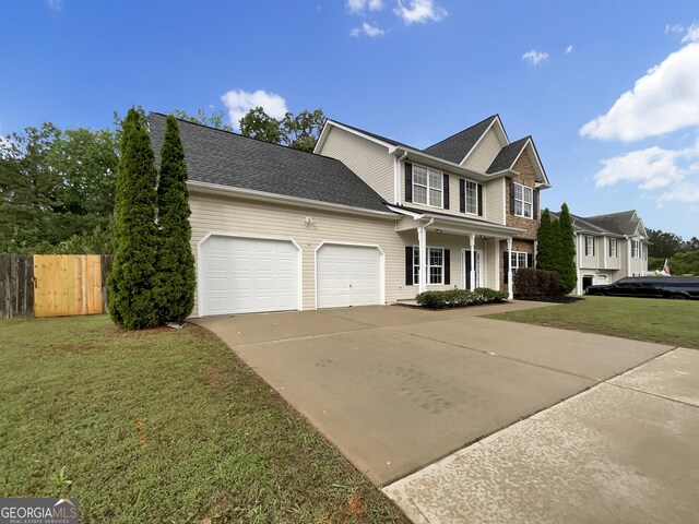 617 Kyles Cir, Hiram, GA 30141 - view of front of property featuring a garage, concrete driveway, and covered porch