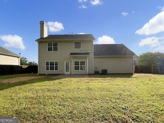 617 Kyles Cir, Hiram, GA 30141 - back of property with a patio area and a chimney