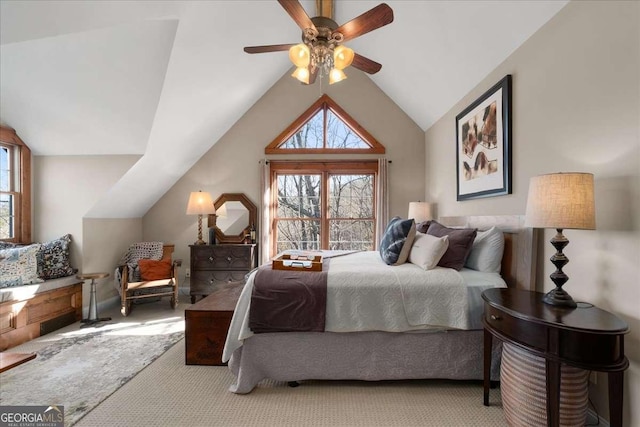 bedroom featuring multiple windows, carpet floors, lofted ceiling, and ceiling fan