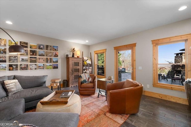 living room with wood finished floors, recessed lighting, and baseboards