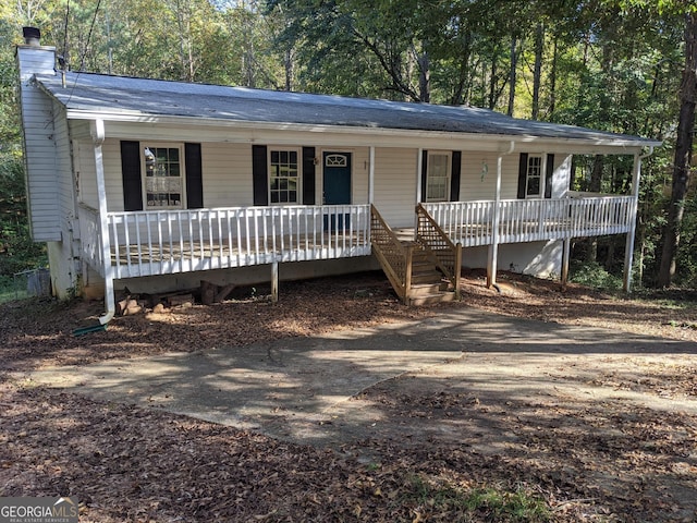 135 Beverly Park Ct, Newnan, GA 30263 - ranch-style home featuring a porch and a chimney