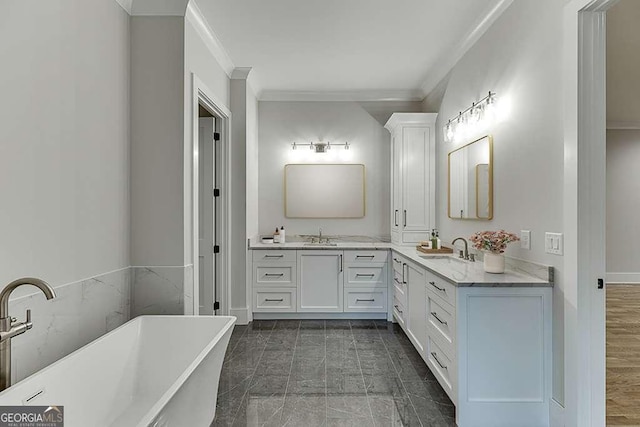 7620 Breeze Bay Rd, Cumming, GA 30041 - bathroom featuring ornamental molding, vanity, a freestanding bath, and baseboards