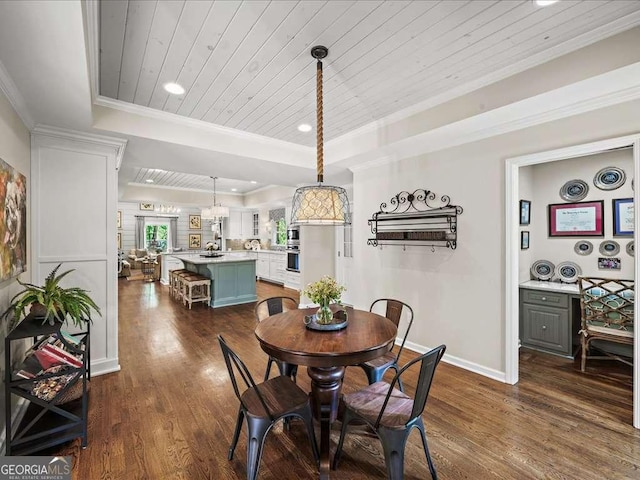 dining area with wood ceiling, dark wood-style flooring, a tray ceiling, recessed lighting, and crown molding