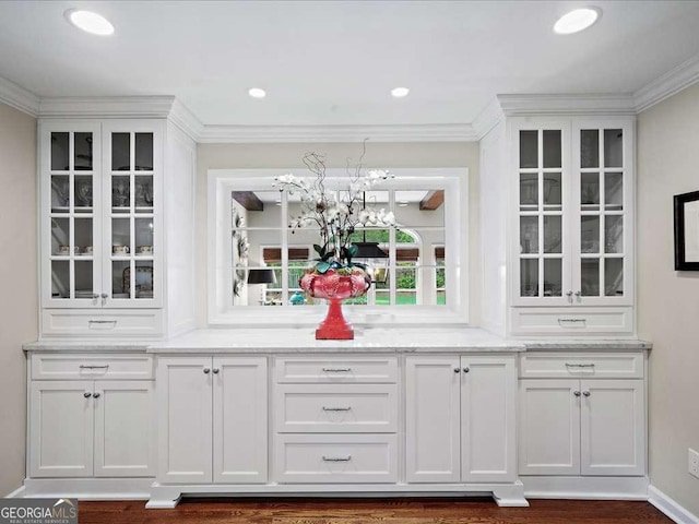 bar featuring crown molding and recessed lighting