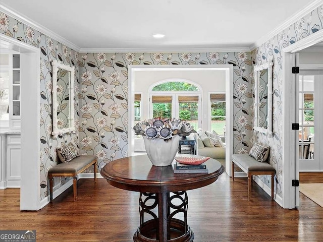 sitting room featuring wallpapered walls, crown molding, wood finished floors, and baseboards