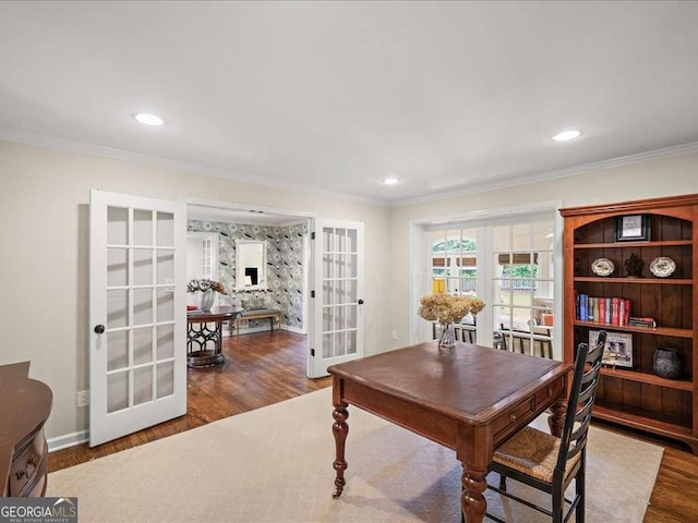 dining space with french doors, wood finished floors, crown molding, baseboards, and recessed lighting