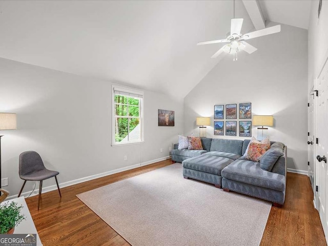 living room with wood finished floors, beam ceiling, baseboards, ceiling fan, and high vaulted ceiling