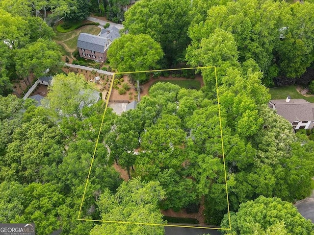 aerial view of property and surrounding area featuring property parcel outlined