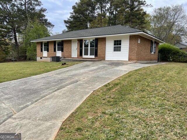 6927 Eunice Dr, Riverdale, GA 30274 - ranch-style house featuring brick siding, concrete driveway, a front lawn, and central air condition unit