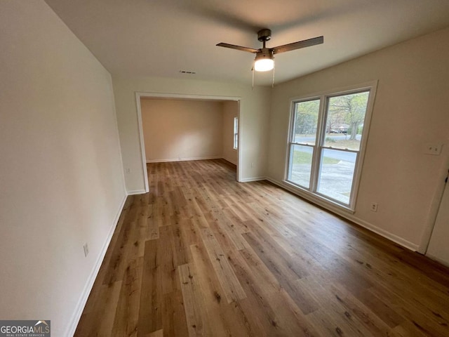 6927 Eunice Dr, Riverdale, GA 30274 - unfurnished dining area featuring wood finished floors, baseboards, and a ceiling fan