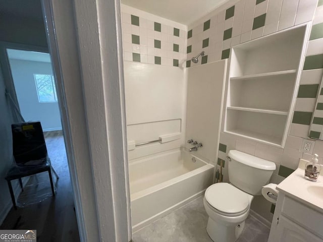 6927 Eunice Dr, Riverdale, GA 30274 - full bath with tile walls, vanity, shower / bath combination, and toilet
