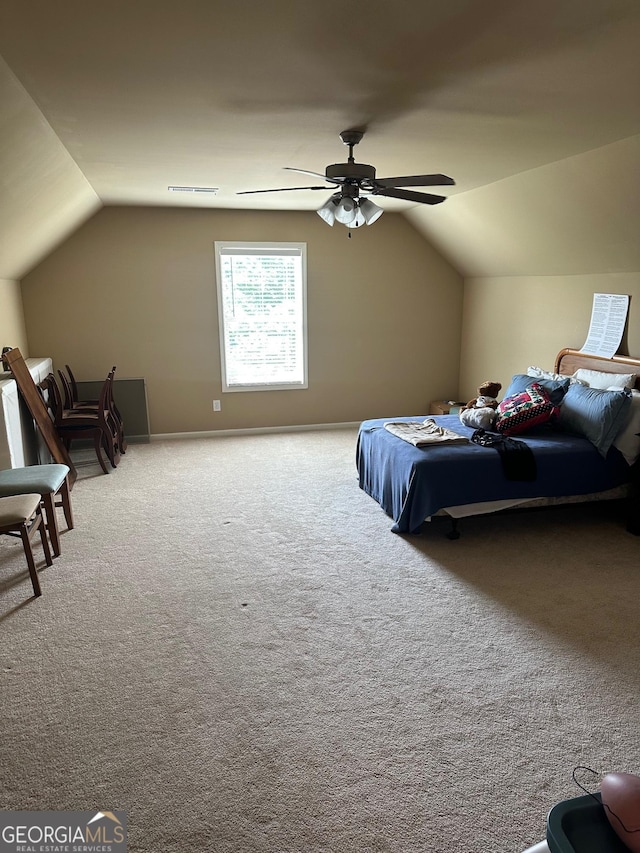 bedroom featuring lofted ceiling, carpet flooring, and a ceiling fan