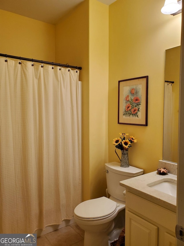 106 Hamway Ln, Winder, GA 30680 - bathroom with toilet, vanity, and tile patterned floors
