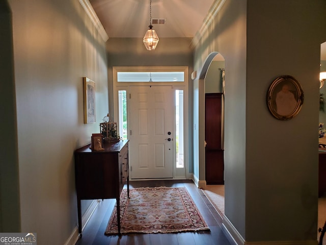 106 Hamway Ln, Winder, GA 30680 - foyer with arched walkways, wood finished floors, and baseboards